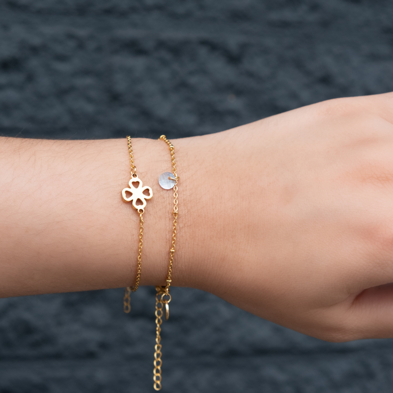 Gouden clover armband met armbandje met schelpje nieuw