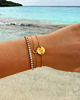 Gouden armparty met where we met armband